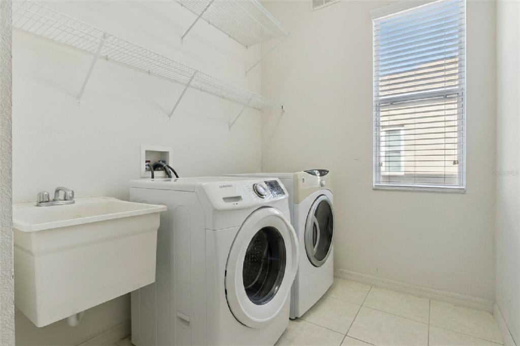 3643 Peaceful Valley Drive Clermont, FL 34711 - Photo 28 of 52 a utility room with dryer and washer