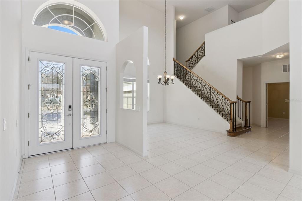 3643 Peaceful Valley Drive Clermont, FL 34711 - Photo 3 of 52 a view of entryway and hall with a front door
