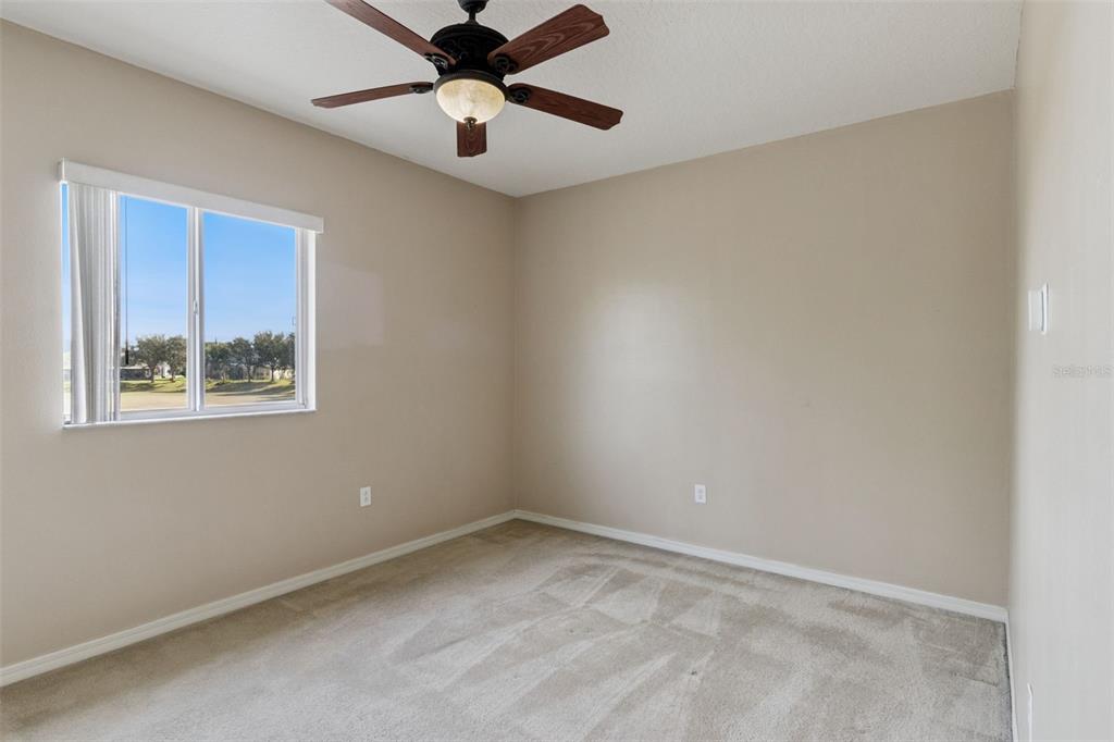 3643 Peaceful Valley Drive Clermont, FL 34711 - Photo 37 of 52 an empty room with a window and a ceiling fan