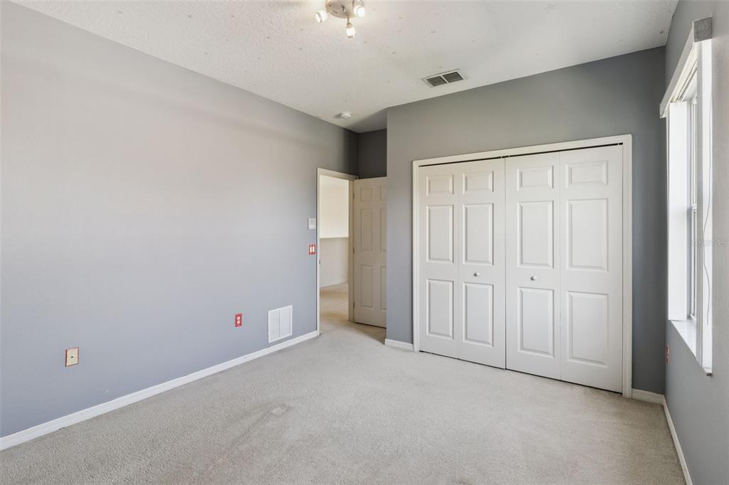 3643 Peaceful Valley Drive Clermont, FL 34711 - Photo 38 of 52 an empty room with a empty space and windows