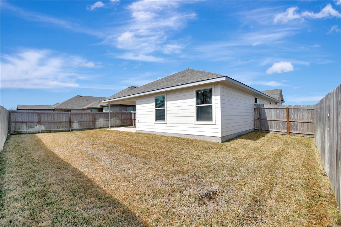 909 Davy Street Brenham, TX 77833 - Photo 30 of 35 Back of house with a fenced backyard