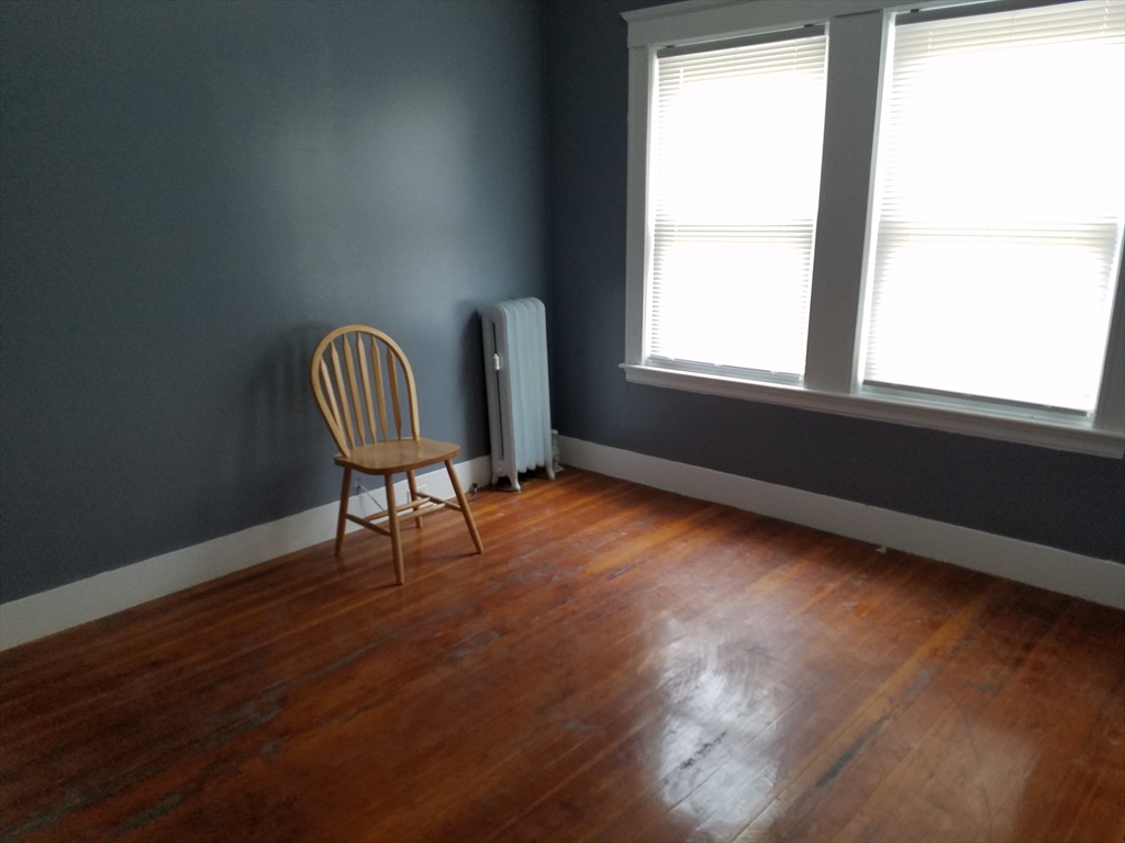 64 Stockton Street Boston, MA 02124 - Photo 18 of 27 a view of a workspace with furniture and a window