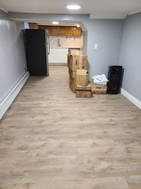 64 Stockton Street Boston, MA 02124 - Photo 24 of 27 a view of kitchen with refrigerator and window