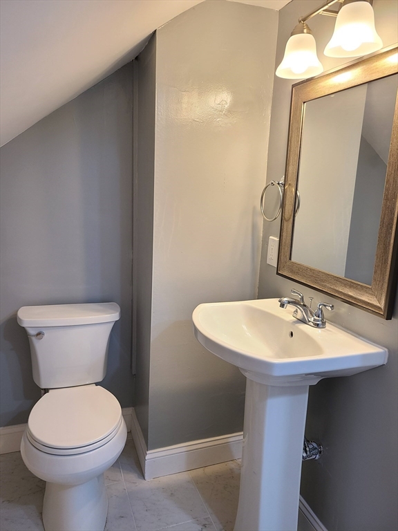 64 Stockton Street Boston, MA 02124 - Photo 7 of 27 a bathroom with a sink and a toilet
