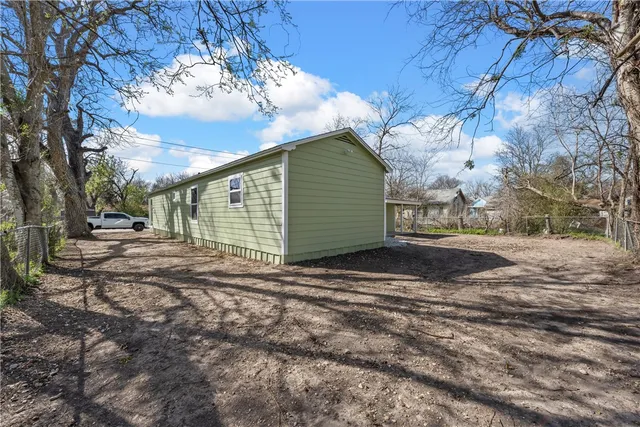 a view of backyard of house