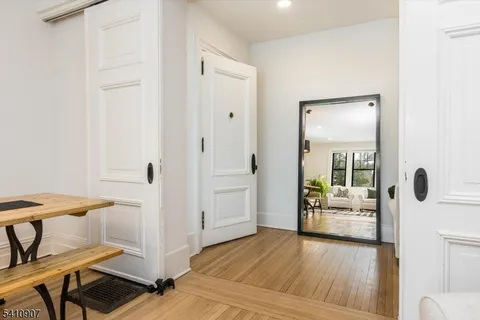 a view of a hallway and dining room