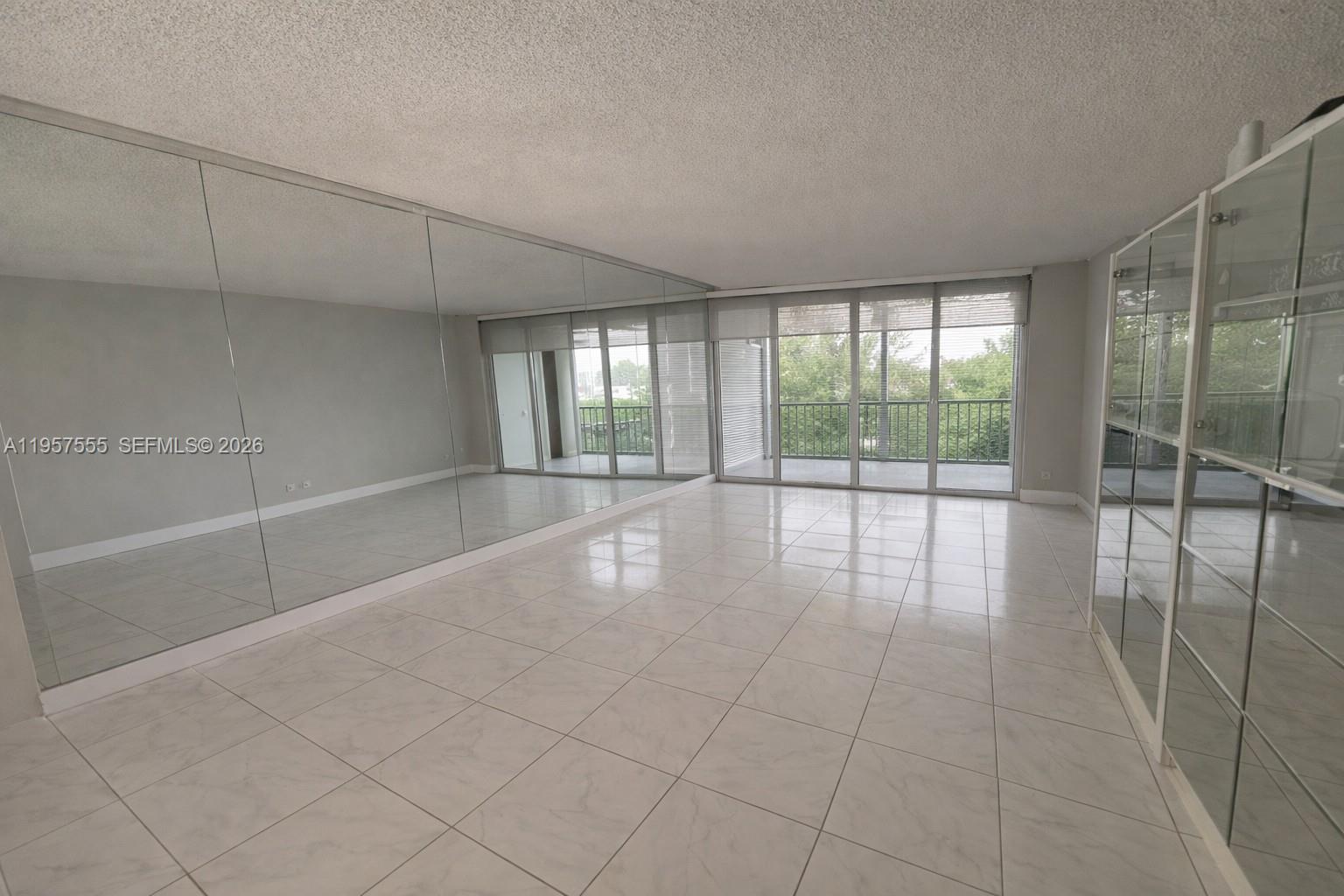 3910 Inverrary Boulevard, Unit 603B Lauderhill, FL 33319 - Photo 3 of 10 a view of an empty room with glass door