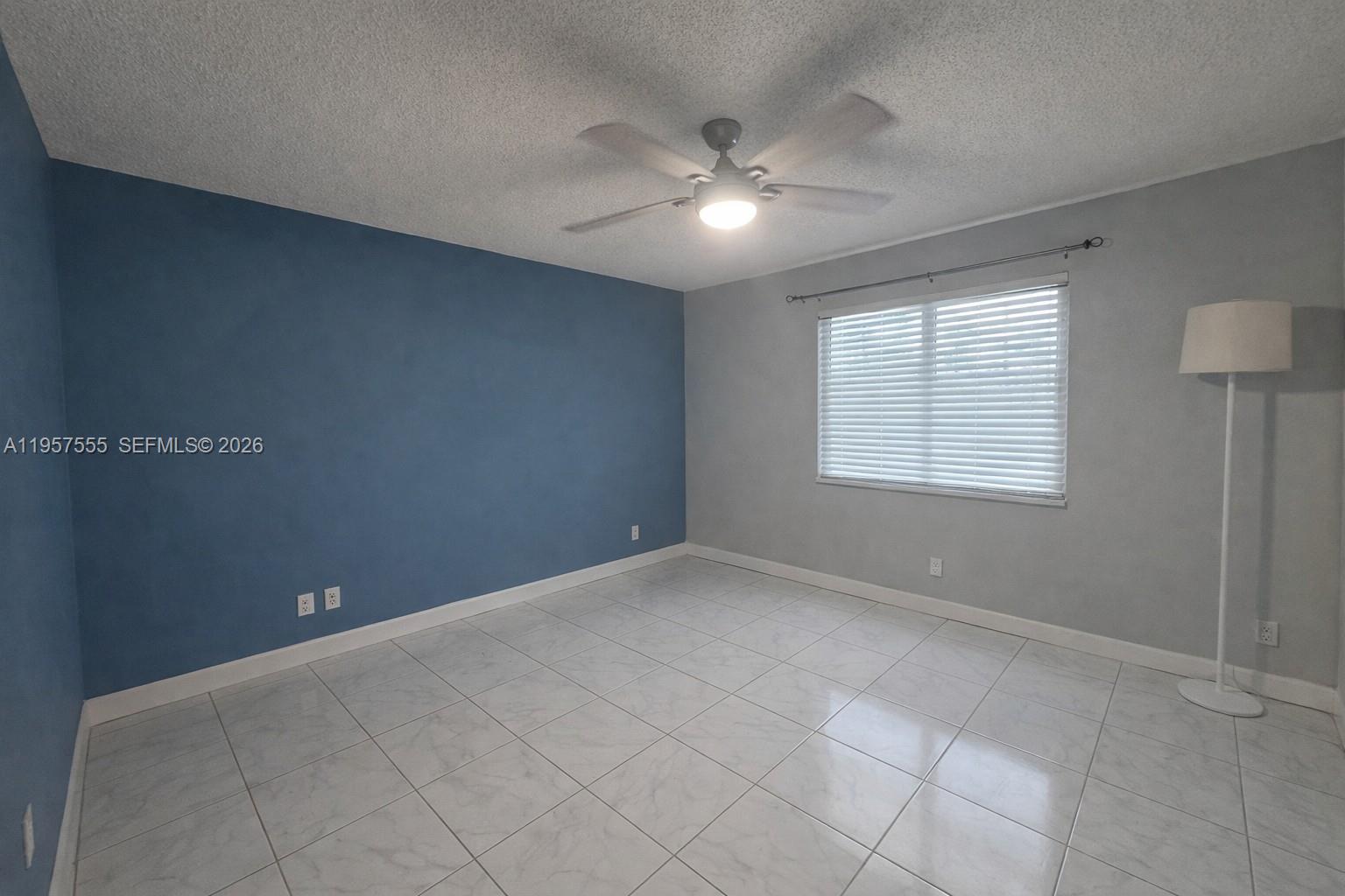 3910 Inverrary Boulevard, Unit 603B Lauderhill, FL 33319 - Photo 8 of 10 a view of an empty room with a window