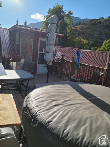 97 East Main Street Stockton, UT 84071 - Photo 13 of 58 Wooden deck with a mountain view
