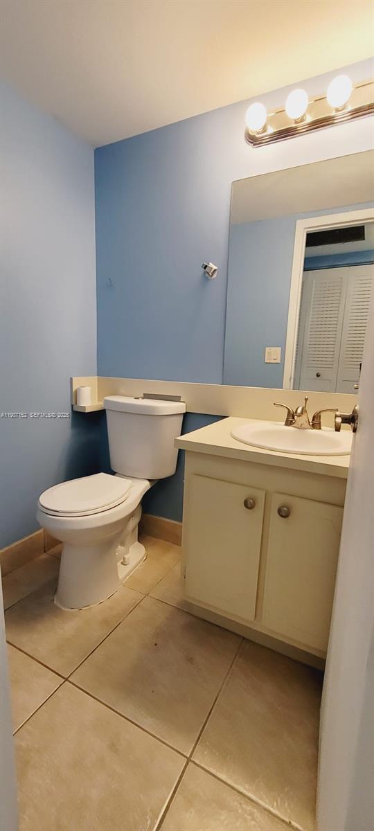 534 Mansfield M, Unit 534 Boca Raton, FL 33434 - Photo 16 of 51 a bathroom with a sink toilet and mirror