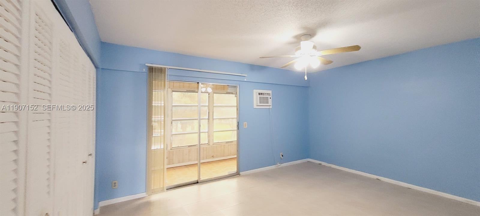 534 Mansfield M, Unit 534 Boca Raton, FL 33434 - Photo 18 of 51 an empty room with windows and fan