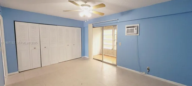 a view of an empty room with a window