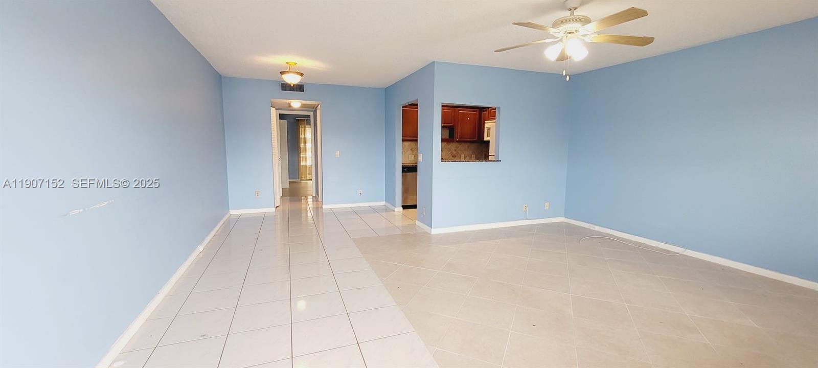 534 Mansfield M, Unit 534 Boca Raton, FL 33434 - Photo 2 of 52 a view of a room with wooden floor and ceiling fan