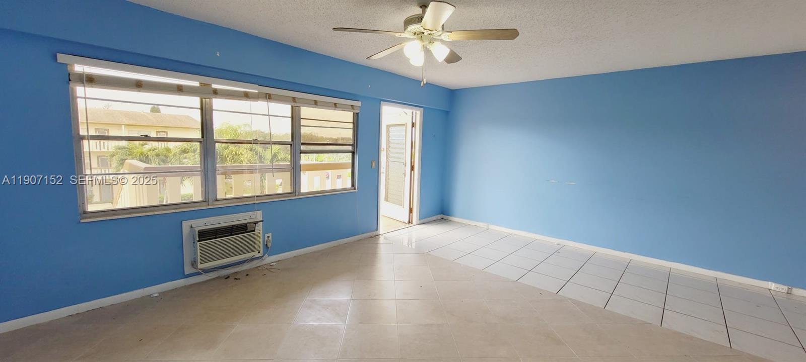 534 Mansfield M, Unit 534 Boca Raton, FL 33434 - Photo 2 of 51 a view of an empty room with a window