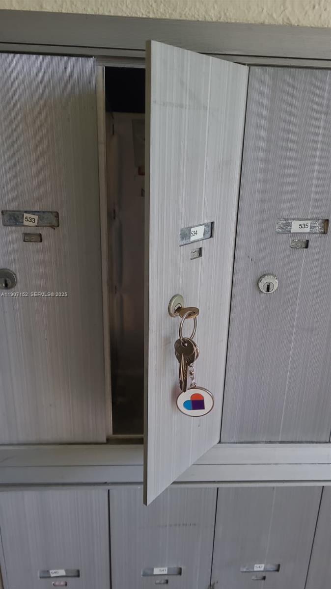534 Mansfield M, Unit 534 Boca Raton, FL 33434 - Photo 25 of 52 a bathroom with a shower and a sink