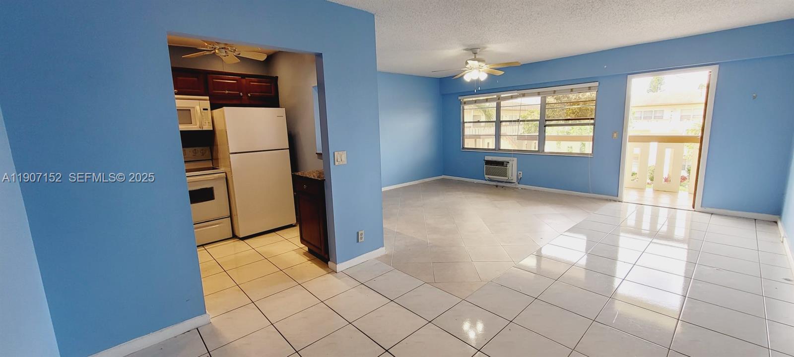 534 Mansfield M, Unit 534 Boca Raton, FL 33434 - Photo 3 of 51 an empty room with windows and closet
