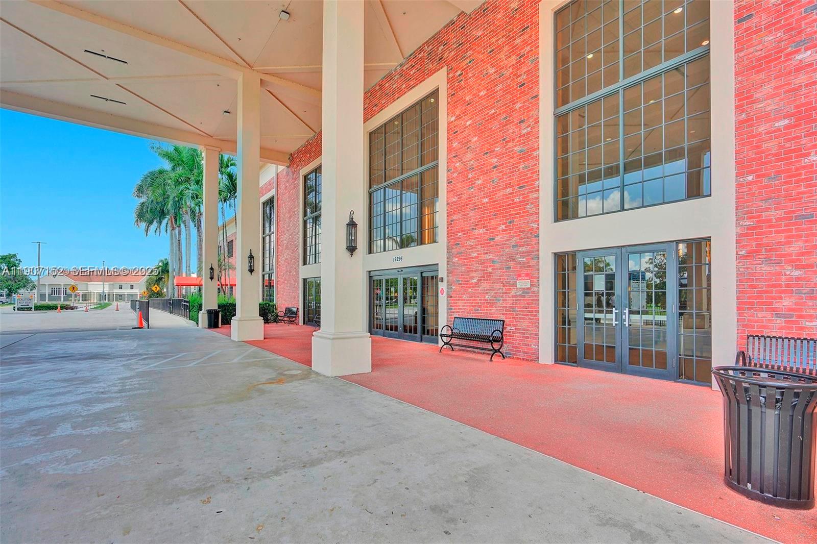 534 Mansfield M, Unit 534 Boca Raton, FL 33434 - Photo 50 of 51 a front view of a building with palm trees