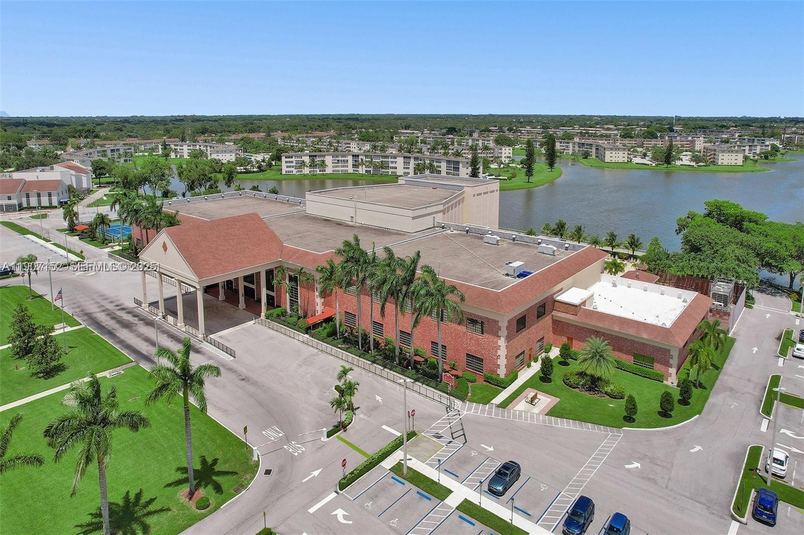 534 Mansfield M, Unit 534 Boca Raton, FL 33434 - Photo 51 of 51 an aerial view of residential houses with outdoor space and river