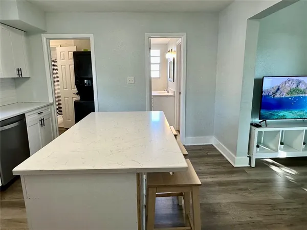 a kitchen with a table and chair