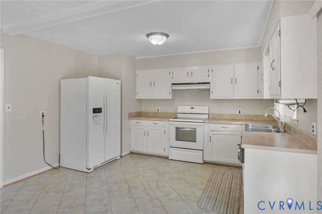 270 Long Acre Road Palmyra, VA 22963 - Photo 4 of 19 a kitchen with granite countertop white cabinets and white appliances