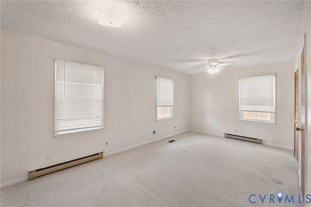 270 Long Acre Road Palmyra, VA 22963 - Photo 6 of 19 an empty room with windows and closet