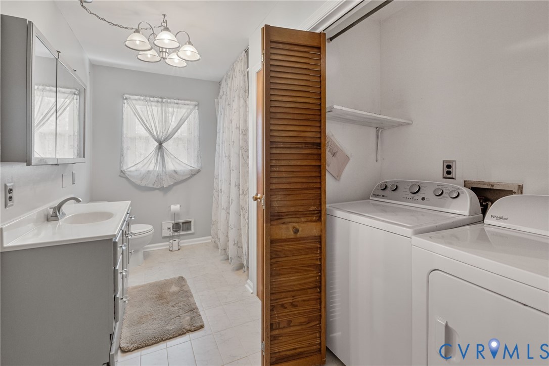 270 Long Acre Road Palmyra, VA 22963 - Photo 8 of 19 a bathroom with a sink a toilet and a mirror