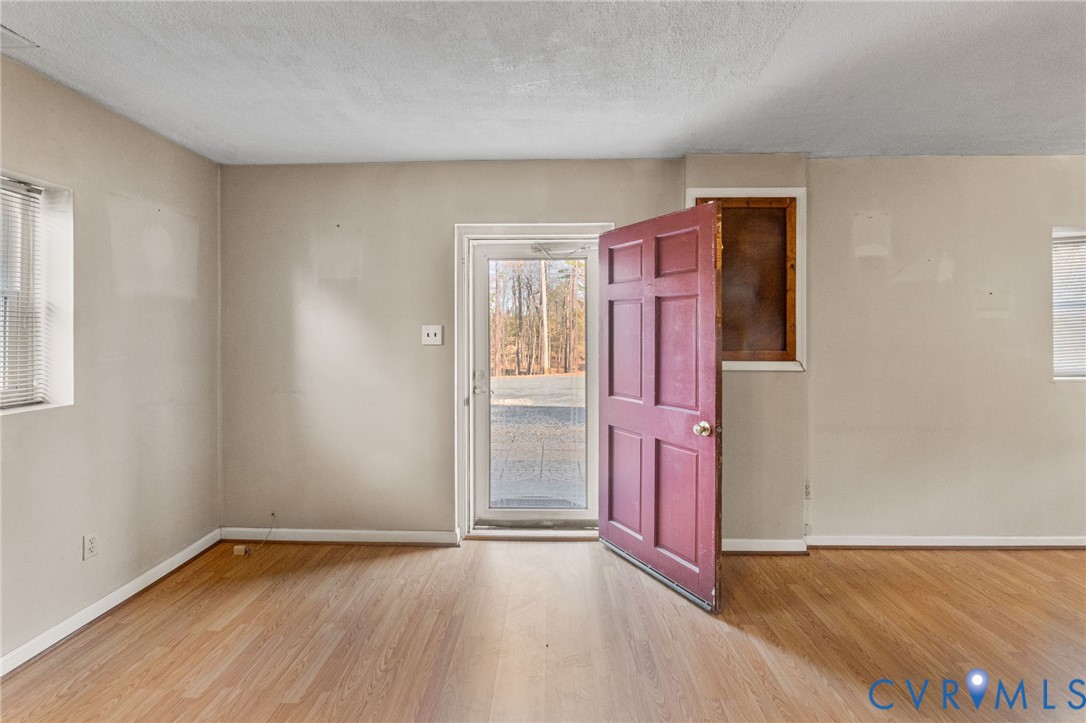 270 Long Acre Road Palmyra, VA 22963 - Photo 10 of 19 wooden floor in an empty room with a window