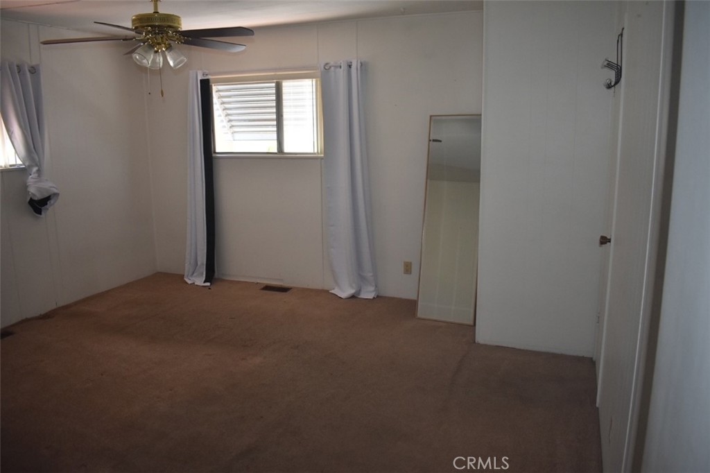 525 North Gilbert, Unit 106 Anaheim, CA 92801 - Photo 13 of 18 an empty room with windows and fan