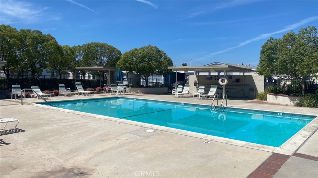 525 North Gilbert, Unit 106 Anaheim, CA 92801 - Photo 4 of 18 a view of a house with swimming pool and a yard