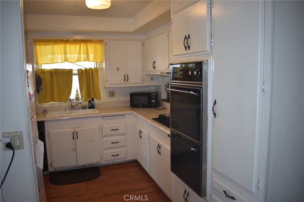 525 North Gilbert, Unit 106 Anaheim, CA 92801 - Photo 9 of 18 a kitchen with white cabinets and window