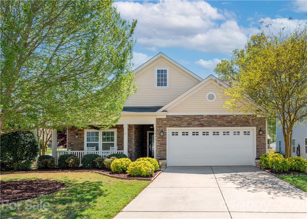 8049 Bryson Road, Unit 117 Indian Land, SC 29707 - Photo 1 of 40 a view of a house with a yard and potted plants