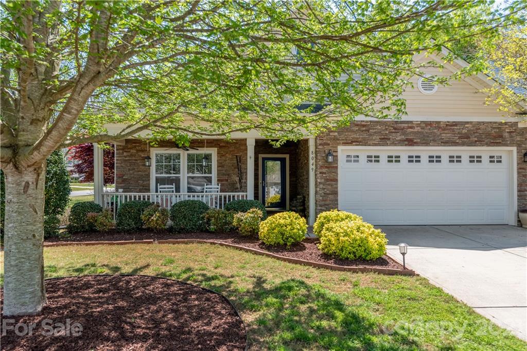 8049 Bryson Road, Unit 117 Indian Land, SC 29707 - Photo 2 of 40 a front view of a house with garden