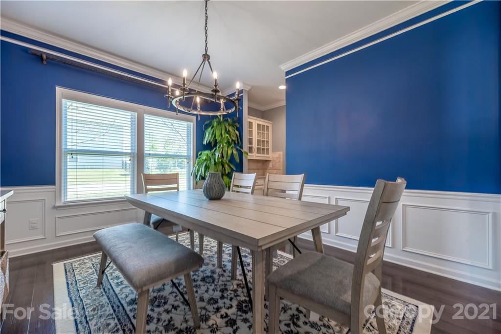 8049 Bryson Road, Unit 117 Indian Land, SC 29707 - Photo 14 of 40 a view of a dining room with furniture window and outside view