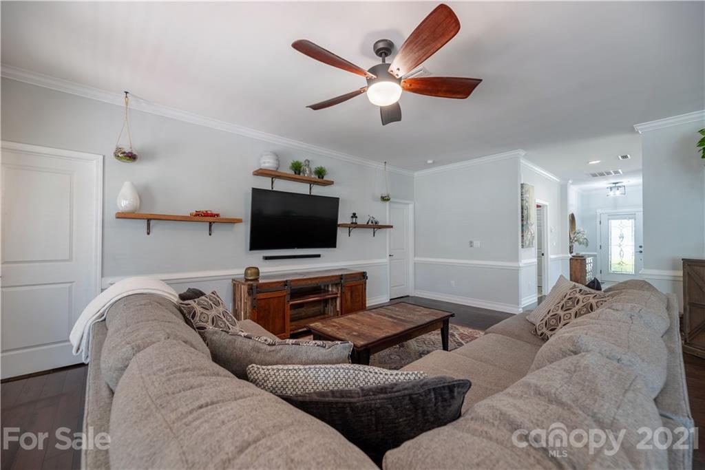 8049 Bryson Road, Unit 117 Indian Land, SC 29707 - Photo 22 of 40 a living room with furniture and a flat screen tv