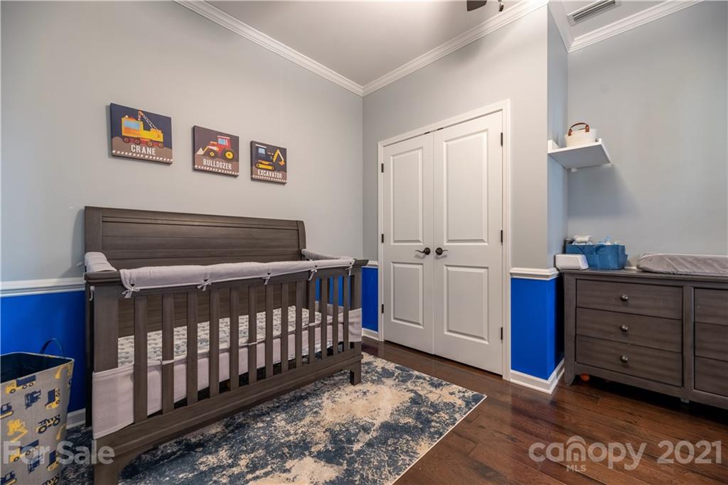 8049 Bryson Road, Unit 117 Indian Land, SC 29707 - Photo 35 of 40 a bedroom with furniture and a window