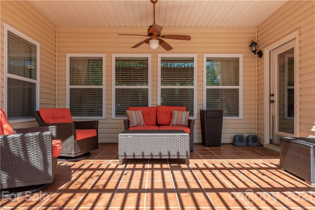 8049 Bryson Road, Unit 117 Indian Land, SC 29707 - Photo 37 of 40 a balcony with furniture and a potted plant
