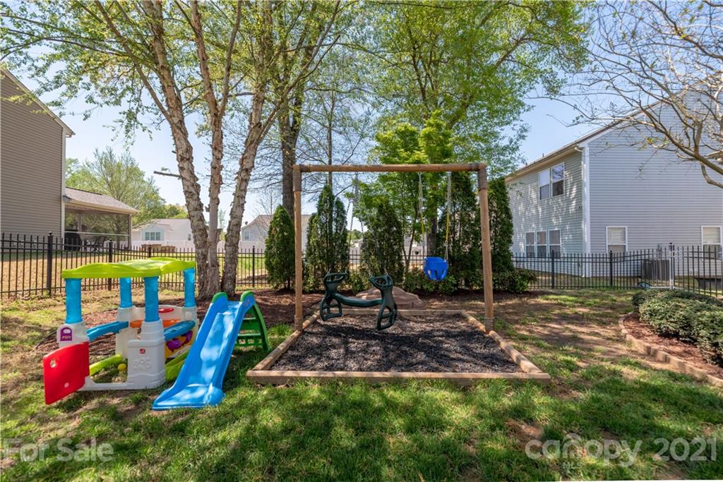 8049 Bryson Road, Unit 117 Indian Land, SC 29707 - Photo 40 of 40 a view of outdoor space with playground and green space