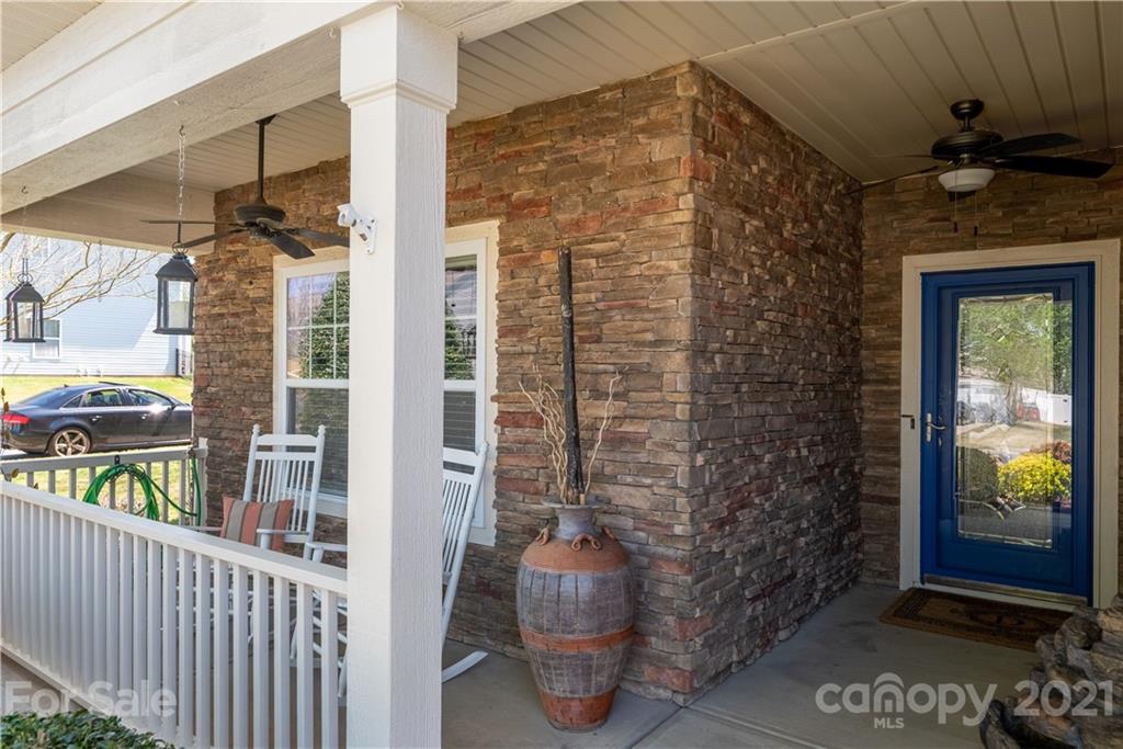 8049 Bryson Road, Unit 117 Indian Land, SC 29707 - Photo 5 of 40 a porch with seating space