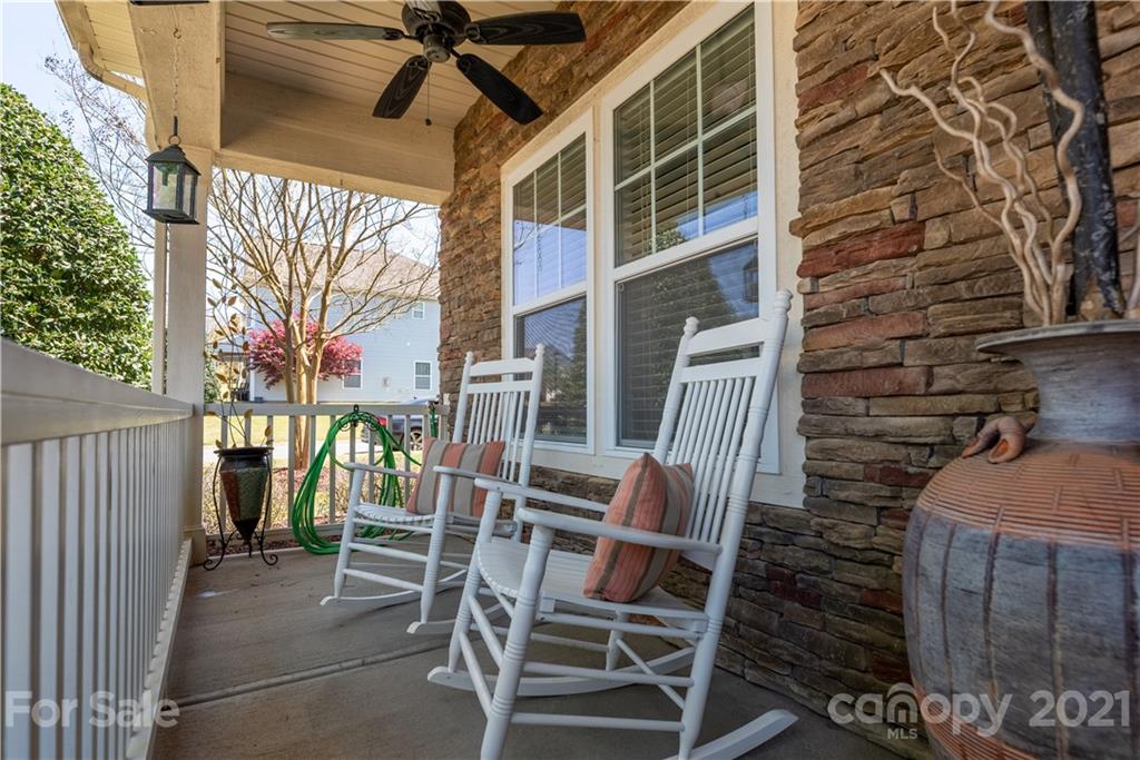 8049 Bryson Road, Unit 117 Indian Land, SC 29707 - Photo 6 of 40 a view of a patio with a table and chairs