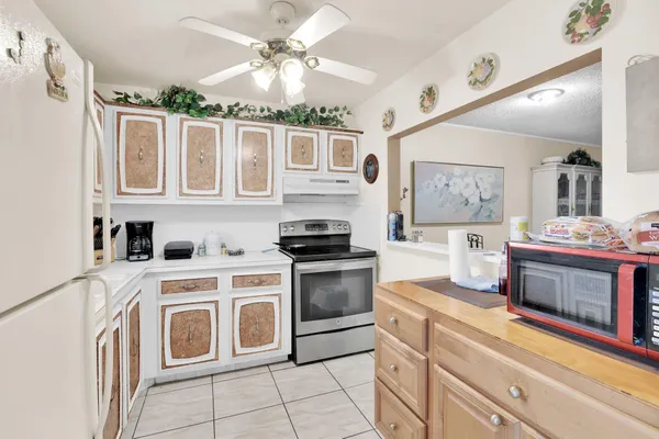 a kitchen with stainless steel appliances granite countertop a stove and a sink