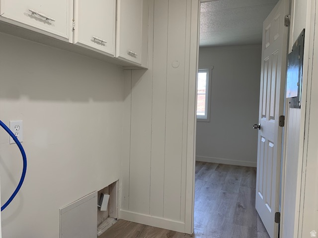 1500 North Angel Street West, Unit 56 Layton, UT 84041 - Photo 16 of 20 Laundry area featuring cabinet space and light wood-style floors