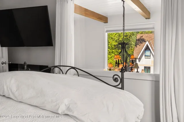 a view of a bedroom with a window