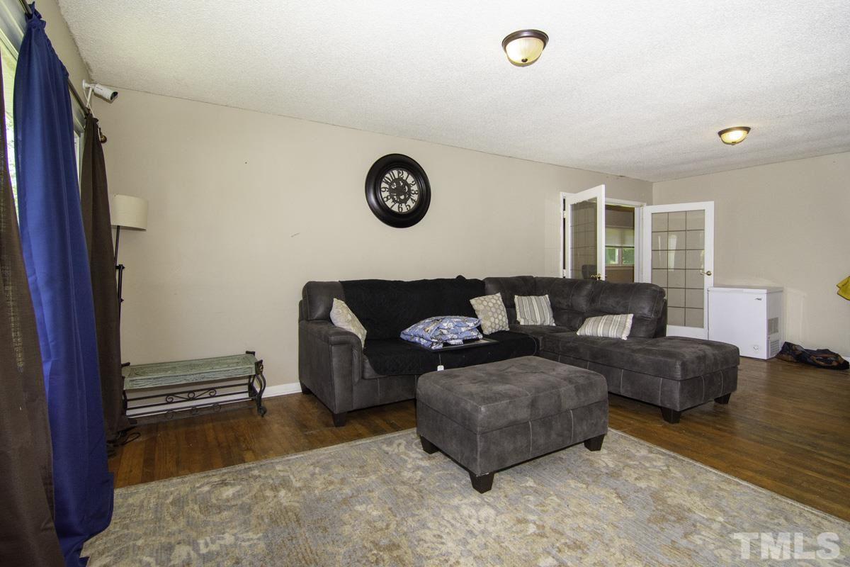 3003 Cheek Road Durham, NC 27704 - Photo 3 of 24 a living room with furniture and a window