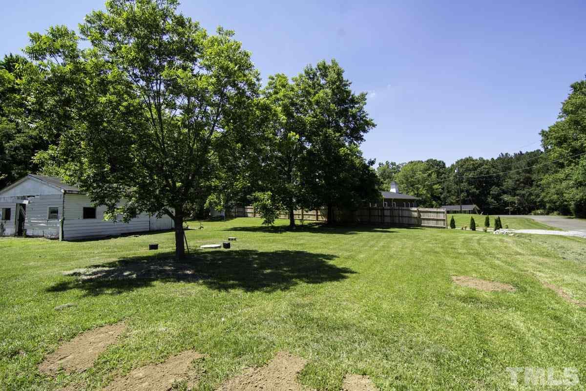 3003 Cheek Road Durham, NC 27704 - Photo 5 of 24 a view of a backyard with green space