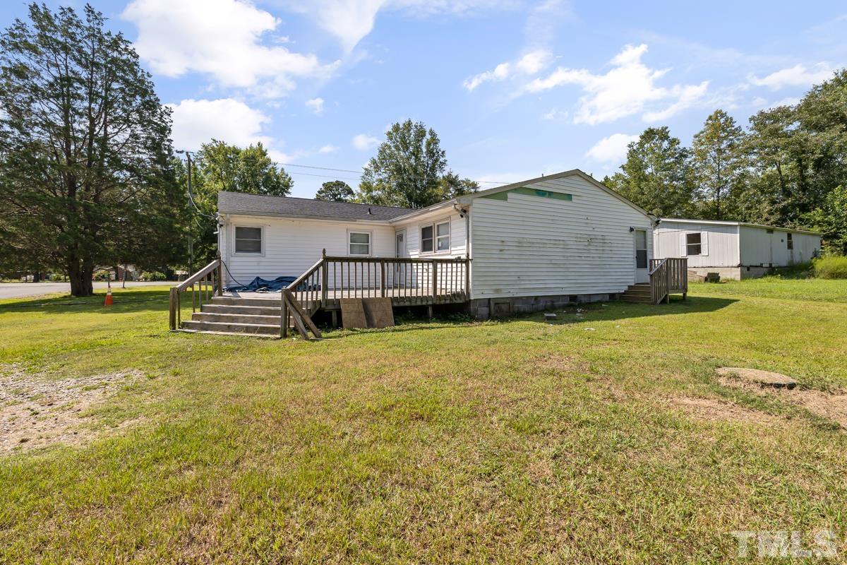 3003 Cheek Road Durham, NC 27704 - Photo 8 of 24 a view of a house with a yard and sitting area