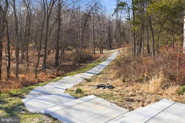 a view of a backyard with table and chairs