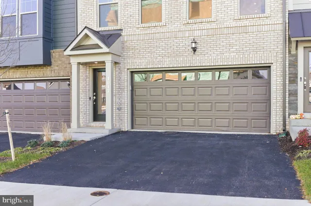 a front view of a house with a garage