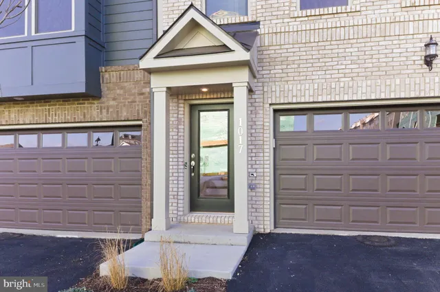 a front view of a building with a yard