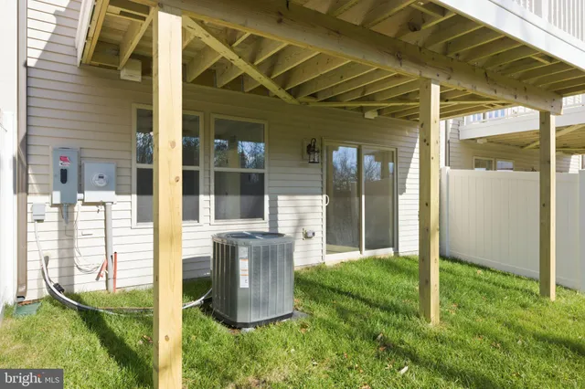 a yard with trees in the background