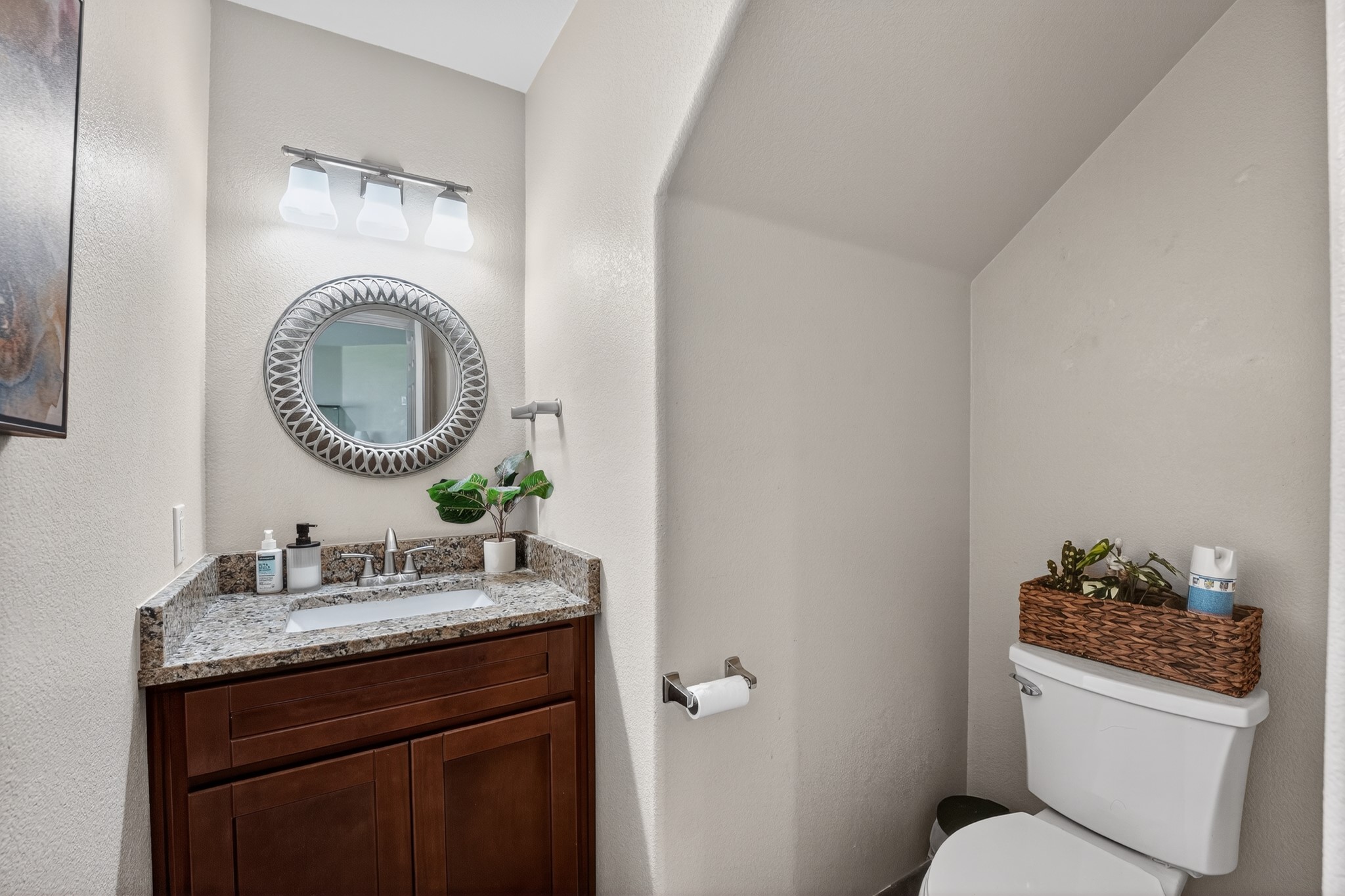 816 Rusk Road Round Rock, TX 78665 - Photo 12 of 29 Powder room featuring a dark wood-finish vanity with a granite-style countertop and an undermount sink